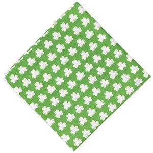 A green novelty pocket square featuring a white shamrock pattern