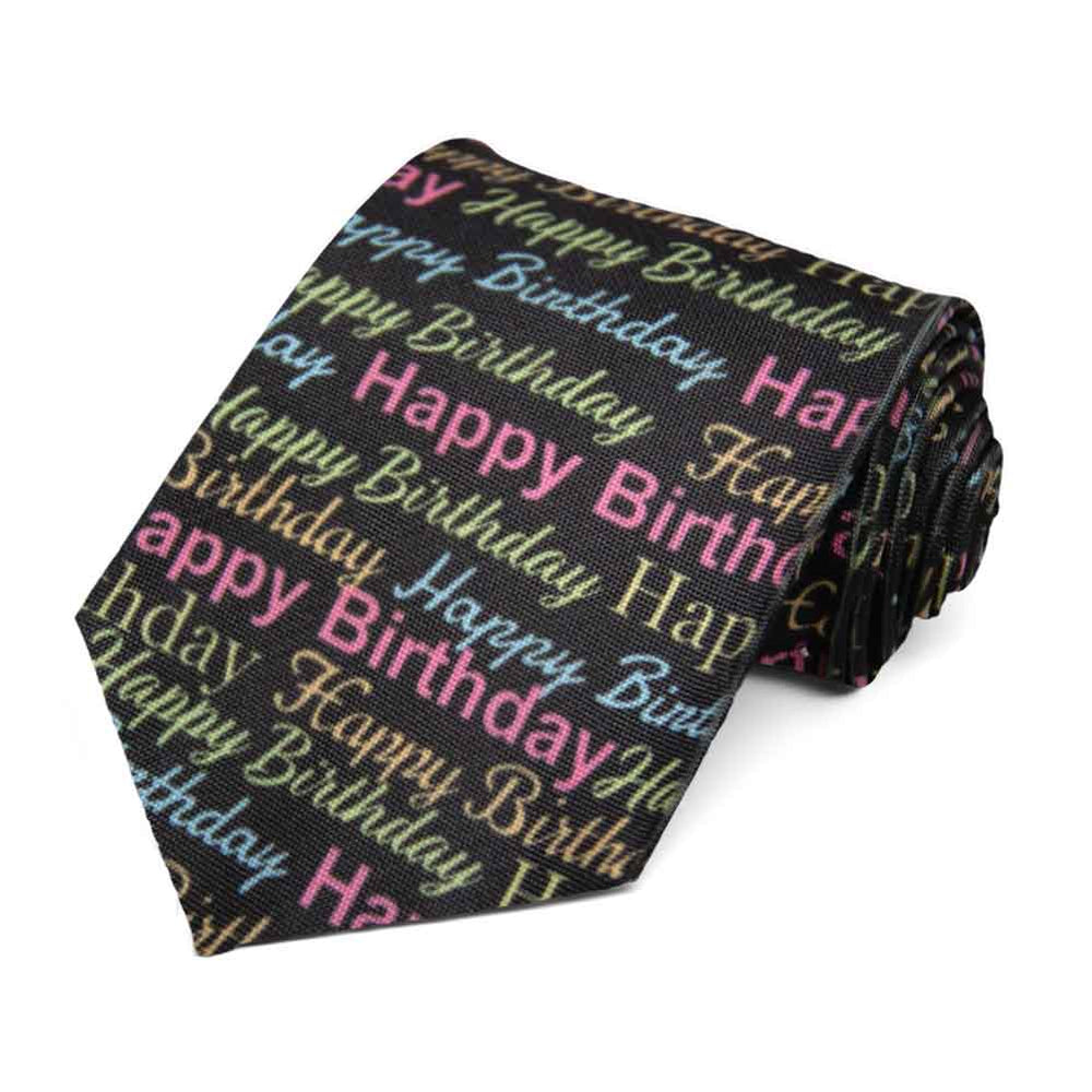Colorful happy birthday novelty text on a black tie