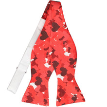 Load image into Gallery viewer, An untied self-tie bow tie, displayed flat, with a scattered hearts design