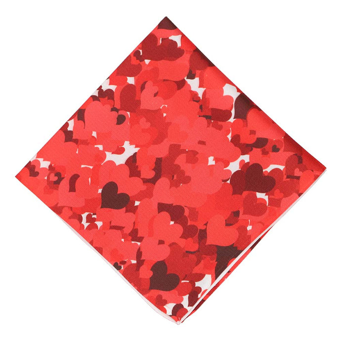 A folded pocket square with a red heart design