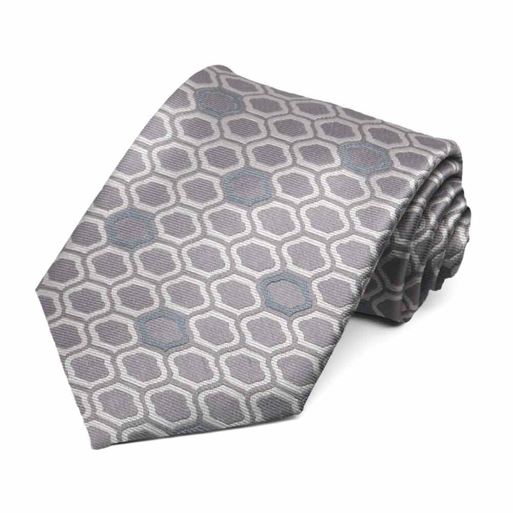 Taupe and off-white necktie in an elegant hexagon like geometric pattern, rolled to show texture