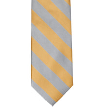 Load image into Gallery viewer, The front of a honey gold and silver striped tie, laid out flat