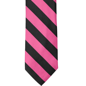 The front of a hot pink and black striped tie, laid out flat
