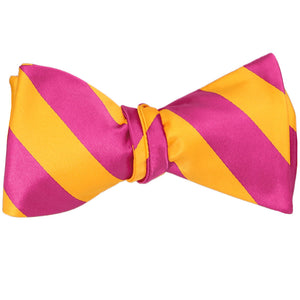 A tied hot pink and golden yellow striped self-tie bow tie