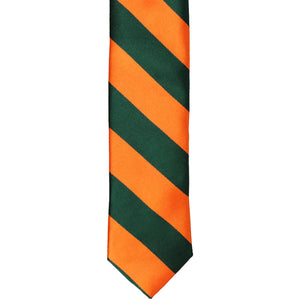 The front of a hunter green and orange striped skinny tie, laid out flat