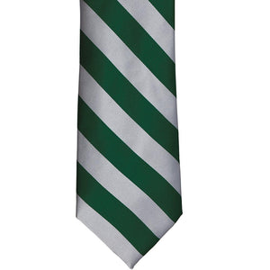 The front of a hunter green and silver striped tie