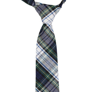 The knot and front of a hunter green, white and blue plaid pre-tied tie