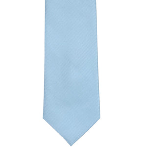 The front of an ice blue herringbone tie, laid out flat