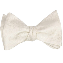 Load image into Gallery viewer, A tied self tie bow tie in an ivory tone-on-tone floral pattern