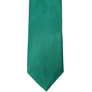 The front of a jade solid tie, laid out flat