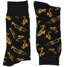 Load image into Gallery viewer, A folded pair of black socks with gold scattered jazz instruments