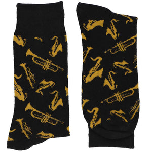A folded pair of black socks with gold scattered jazz instruments