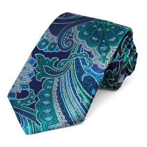 Blue and green jewel toned paisley tie, rolled to show off the elegant pattern