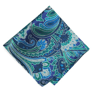 A folded blue green and white paisley pocket square
