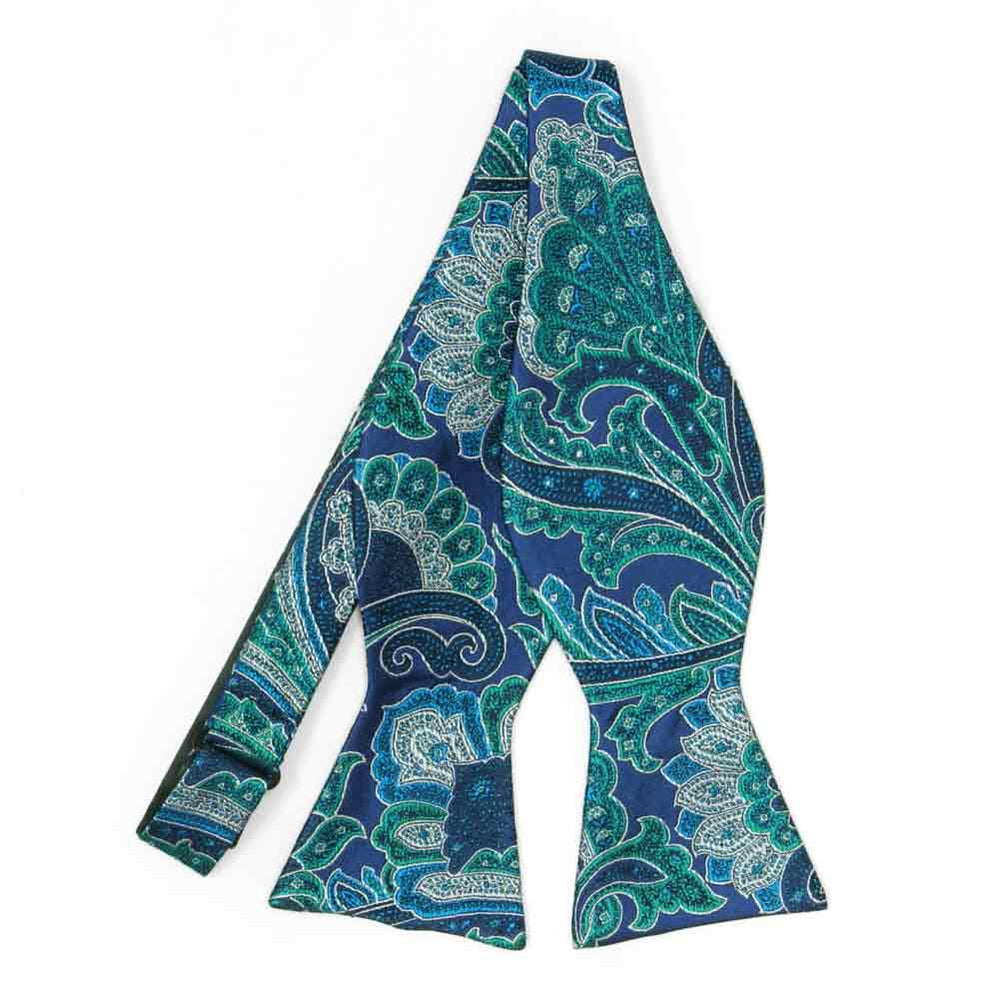 An untied blue self-tie bow tie with large white and turquoise paisley