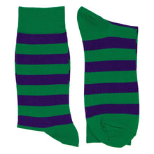 Load image into Gallery viewer, Two kelly green and dark purple socks, folded and laid out flat.