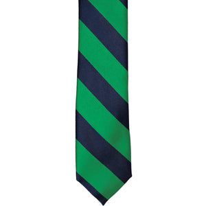 The front of a kelly green and navy blue striped tie, laid out flat