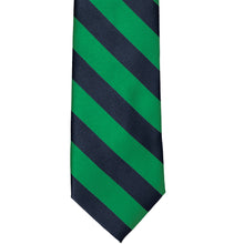 Load image into Gallery viewer, The front of a kelly green and navy blue striped tie, laid out flat
