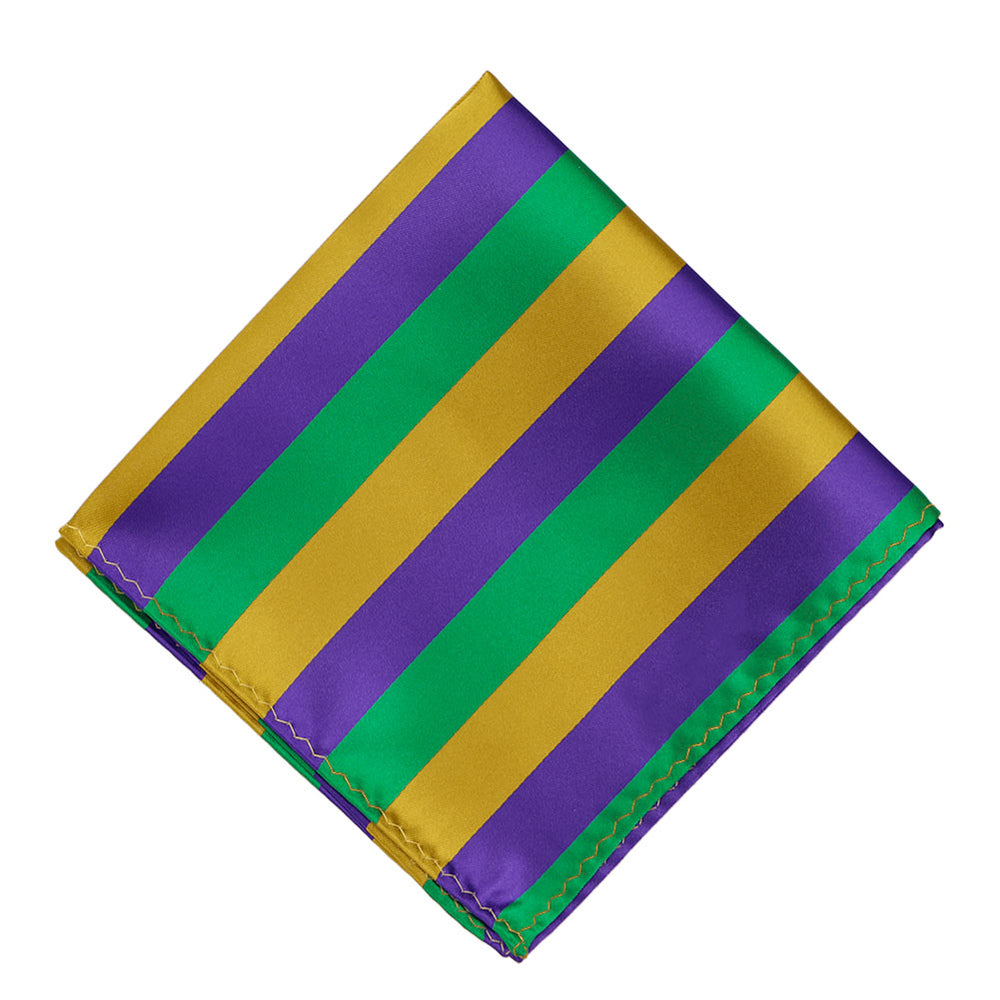A pocket square in dark purple, green and gold, folded into a diamond
