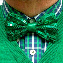 Load image into Gallery viewer, Man wearing a green sequin bow tie with a matching green sweater and plaid shirt