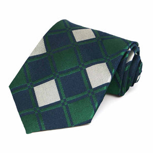 Green, dark blue and cream large square pattern necktie, rolled to show texture and pattern