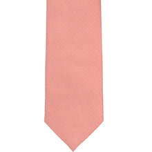Load image into Gallery viewer, The front of a light coral herringbone tie, laid out flat