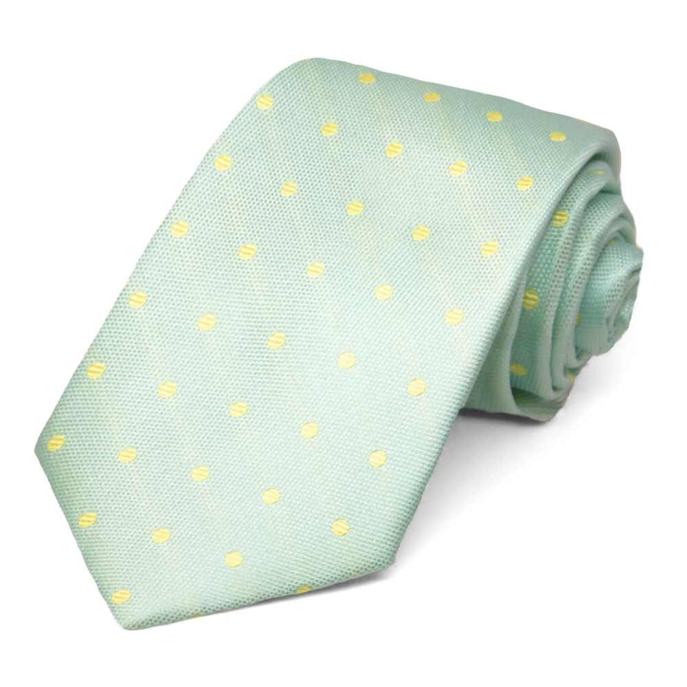Light jade and yellow polka dot tie, rolled to show details up close
