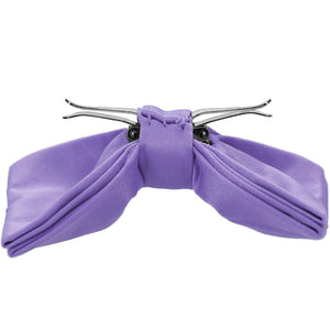 The side view of a light purple clip-on bow tie