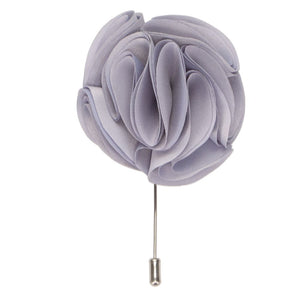 A light silver flower lapel pin with a silver tone pin
