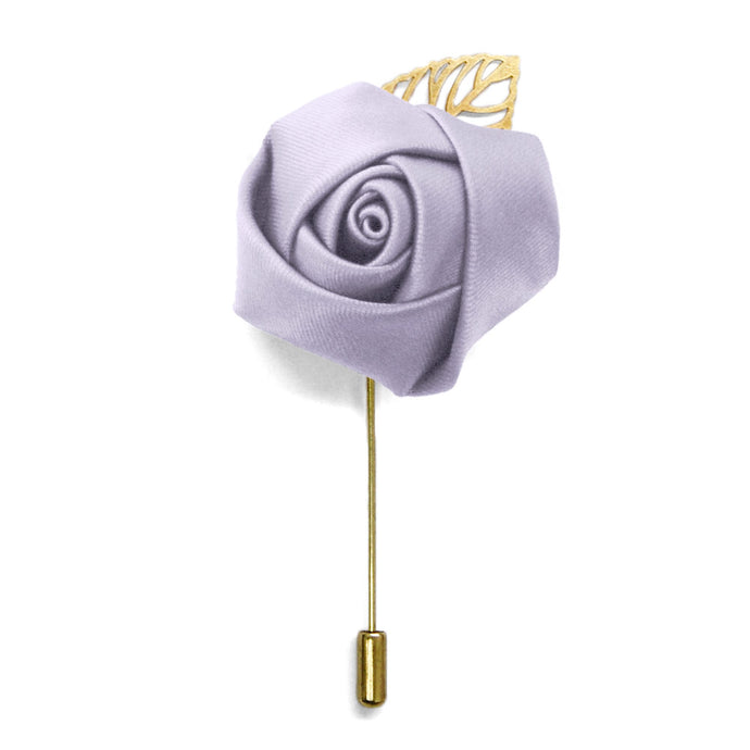 A lilac colored flower lapel pin with gold accents