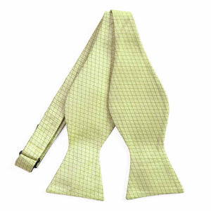 An untied light green self-tie bow tie with a cross hatch pattern
