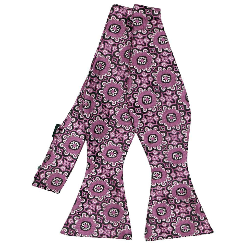 Flat view of an untied deep magenta floral pattern self-tie bow tie