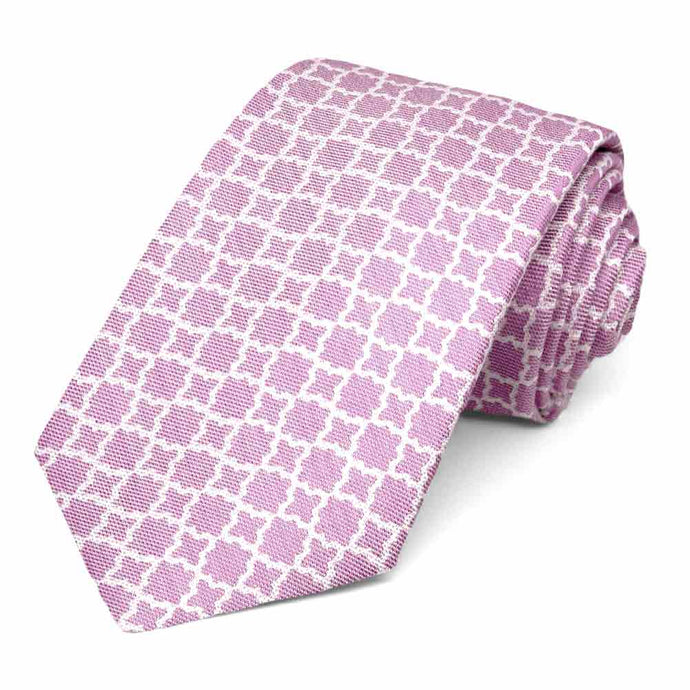 Magenta tie featuring a white trellis pattern, rolled to show woven texture