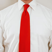 Load image into Gallery viewer, Man wearing a white dress shirt and red solid color tie