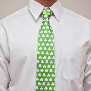 Man wearing a white dress shirt and shamrock tie