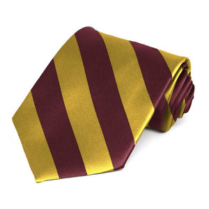 Maroon and gold striped tie, rolled view