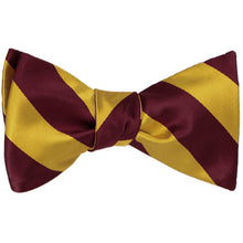 Load image into Gallery viewer, A maroon and gold striped self-tie bow tie, tied