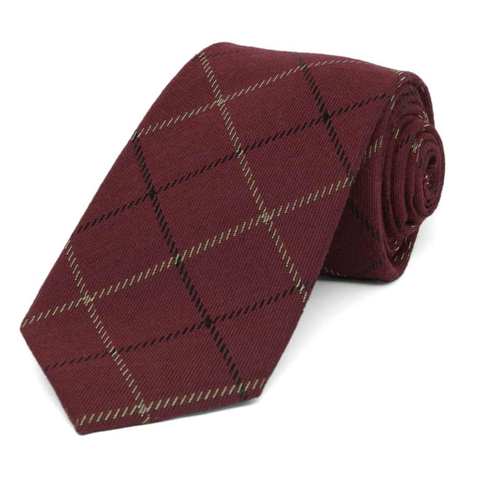 Maroon plaid wool tie, rolled to show texture