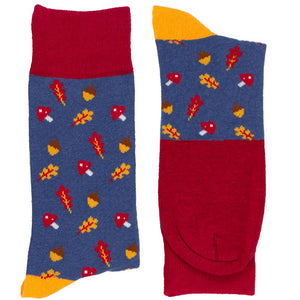 Folded pair of men's acorn, mushroom and leaf pattern socks in shades of dark red, golden yellow and blue