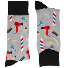 Load image into Gallery viewer, Folded pair of men&#39;s black and gray socks with a barber theme