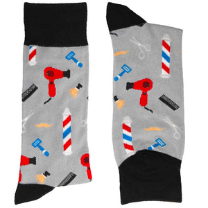 Folded pair of men's black and gray socks with a barber theme