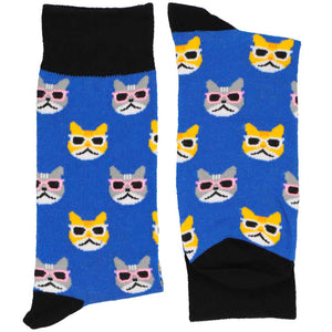 A folded pair of blue socks with cats wearing sunglasses