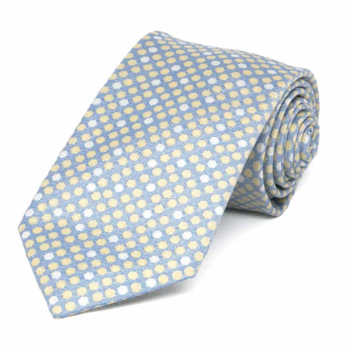 Blue tie with white and yellow polka dots,  rolled to show details up close