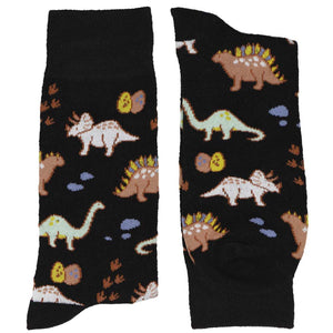 A folded pair of men's black socks with a dinosaur pattern