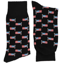 Load image into Gallery viewer, A pair of men&#39;s folded black socks with a pattern of American flags