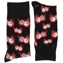 Load image into Gallery viewer, A folded pair of red, black and white dice socks with fire