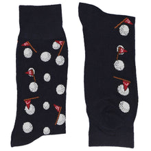 Load image into Gallery viewer, A folded navy pair of men&#39;s socks with a novelty golf ball and flag design