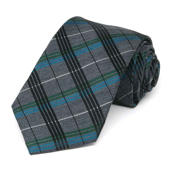 Dark gray plaid tie with jewel tones, rolled to show the woven texture
