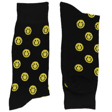 Load image into Gallery viewer, A folded pair of smiley face socks on a black background