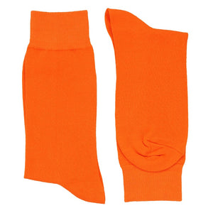 Pair of men's tangerine dress socks folded